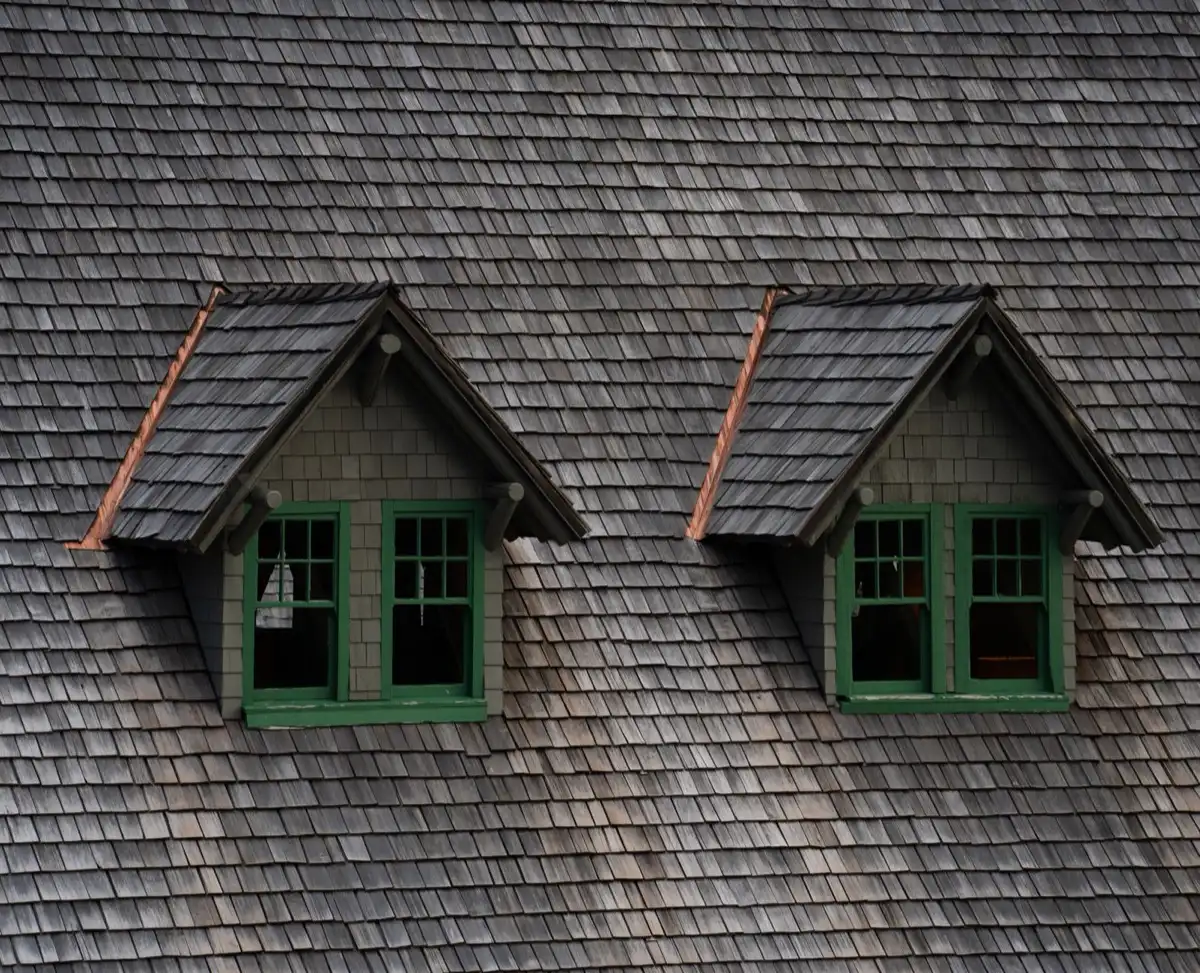Dormers on a shingle roof in Memphis, TN, where step flashing and kickout flashing carry water past the walls
